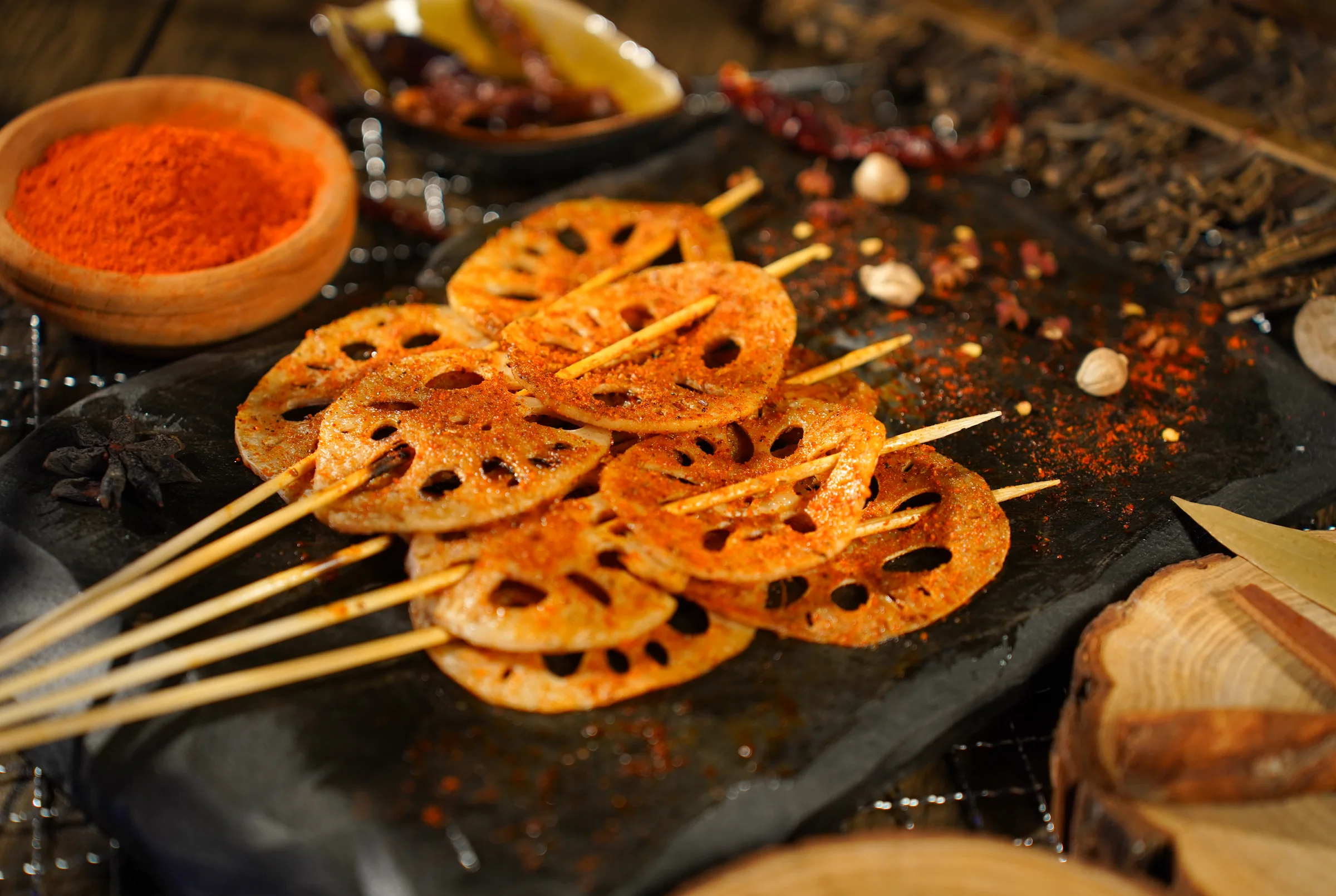 Grilled lotus root skewers dusted with chilli