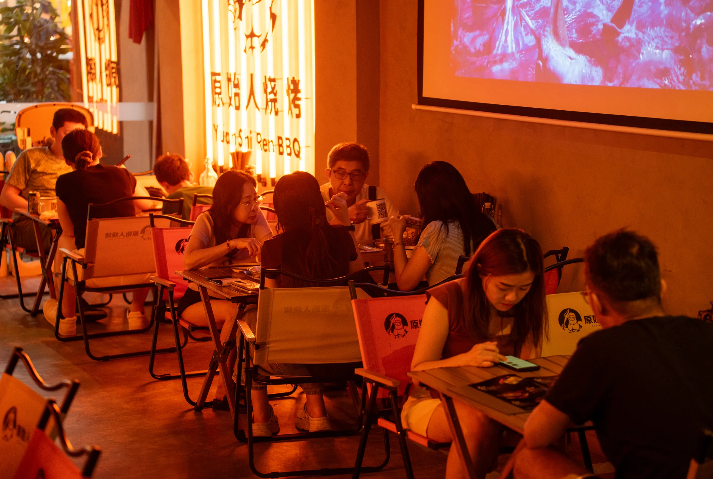 Friends at camping tables inside the George Town outlet