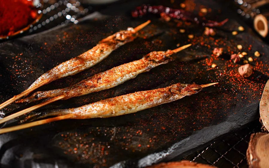 Grilled shishamo fish skewers